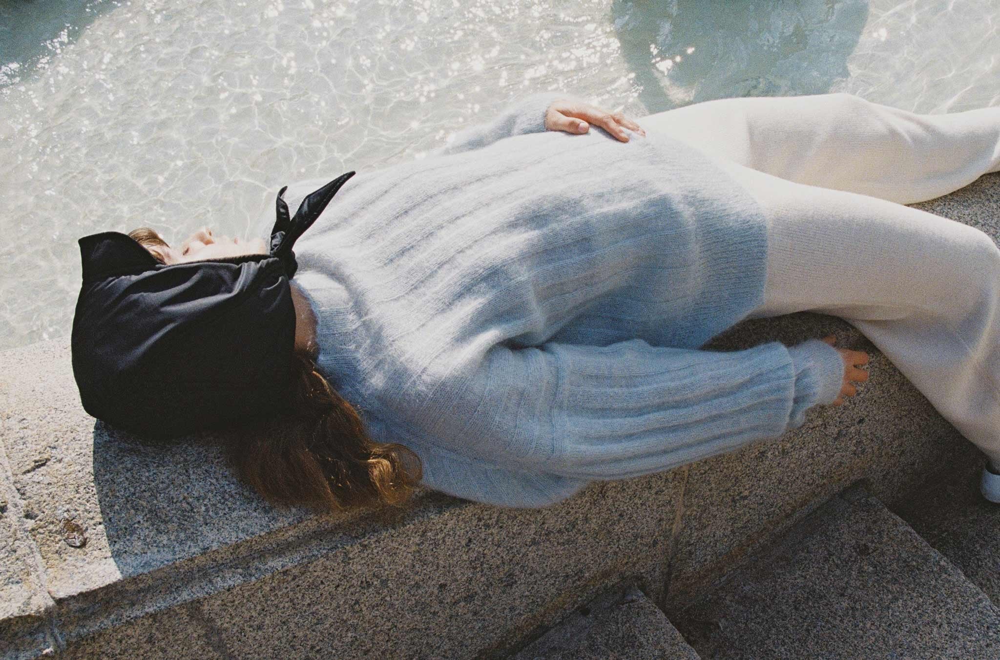 NORI headscarf in Ink, MAKURA sweater in Pale Blue and NAIFU pants in Chalk.