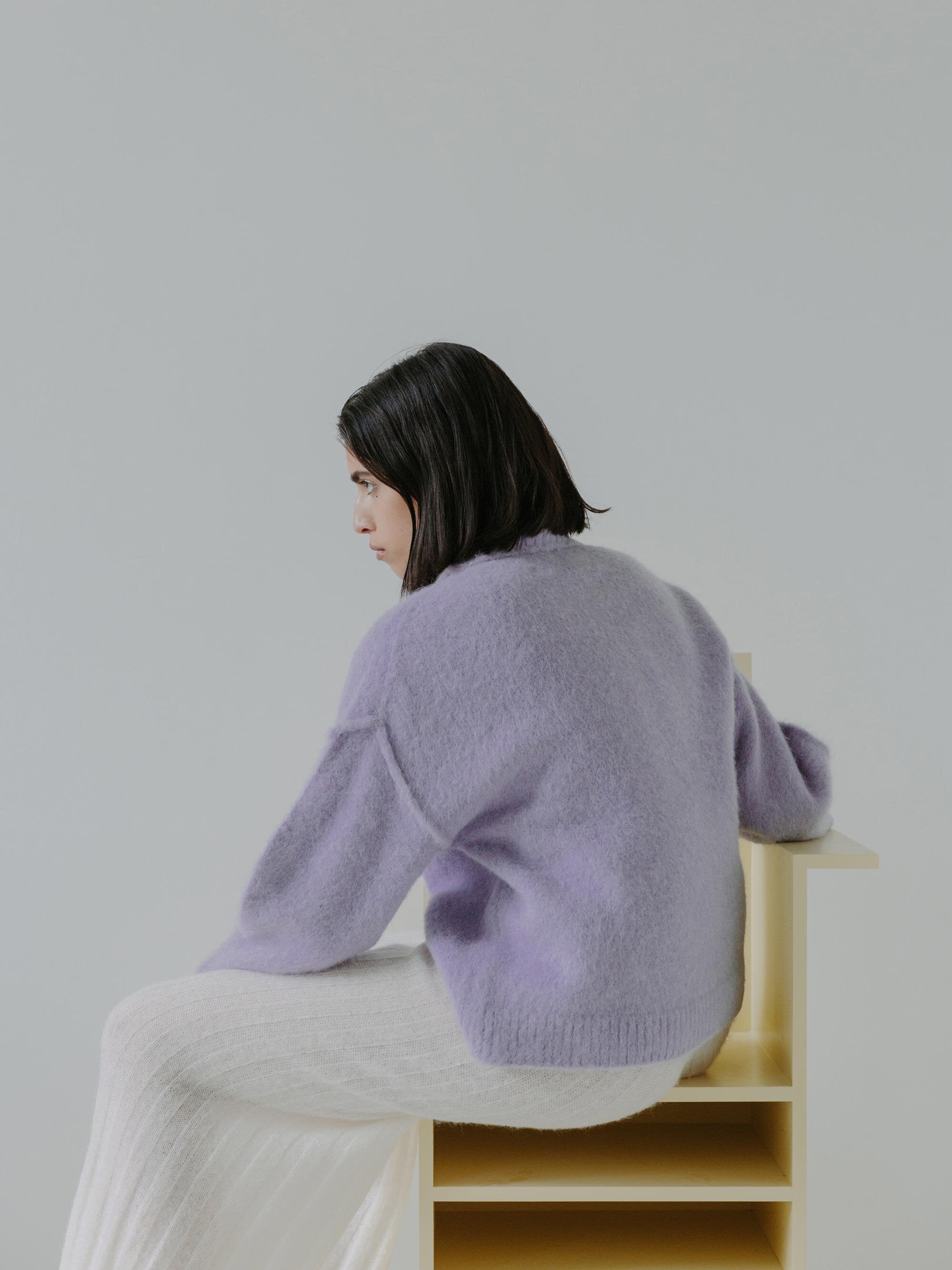 Esra wearing the KIRUTO sweater and SHOJI pants with chair N02F006. Photographed by Marina Denisova.